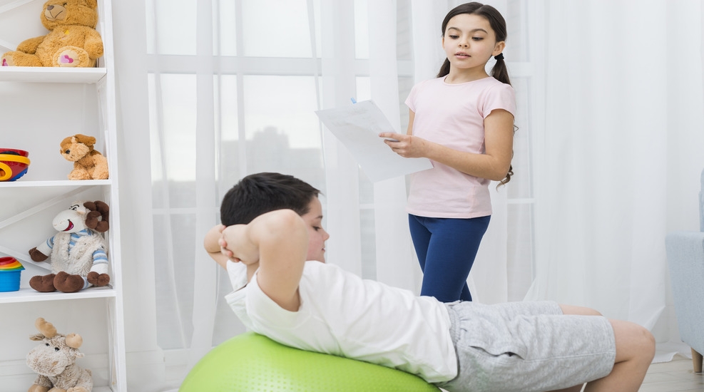 Pediatric physiotherapy session with a child