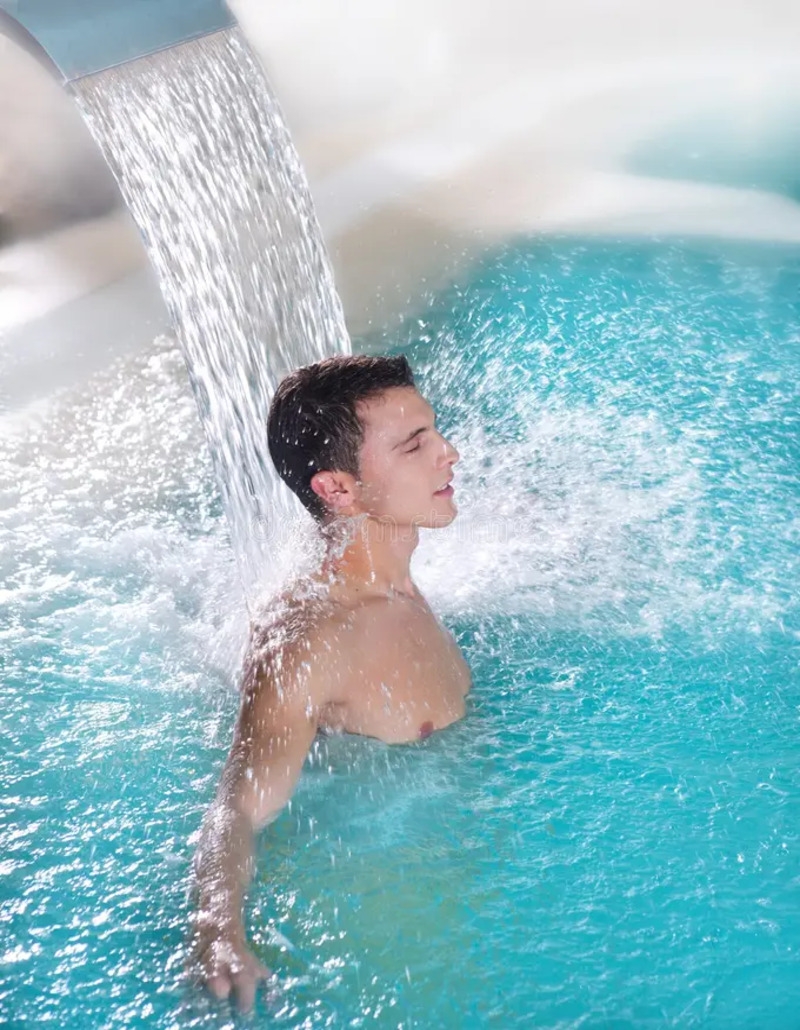Patient performing hydrotherapy exercises in a pool